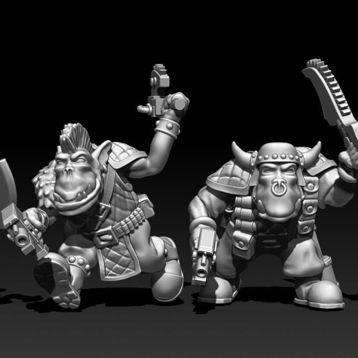 Two Guttertech Goblin Raider resin miniatures by Trollet Miniatures, armed with axes and blasters for sci-fi tabletop wargaming.
