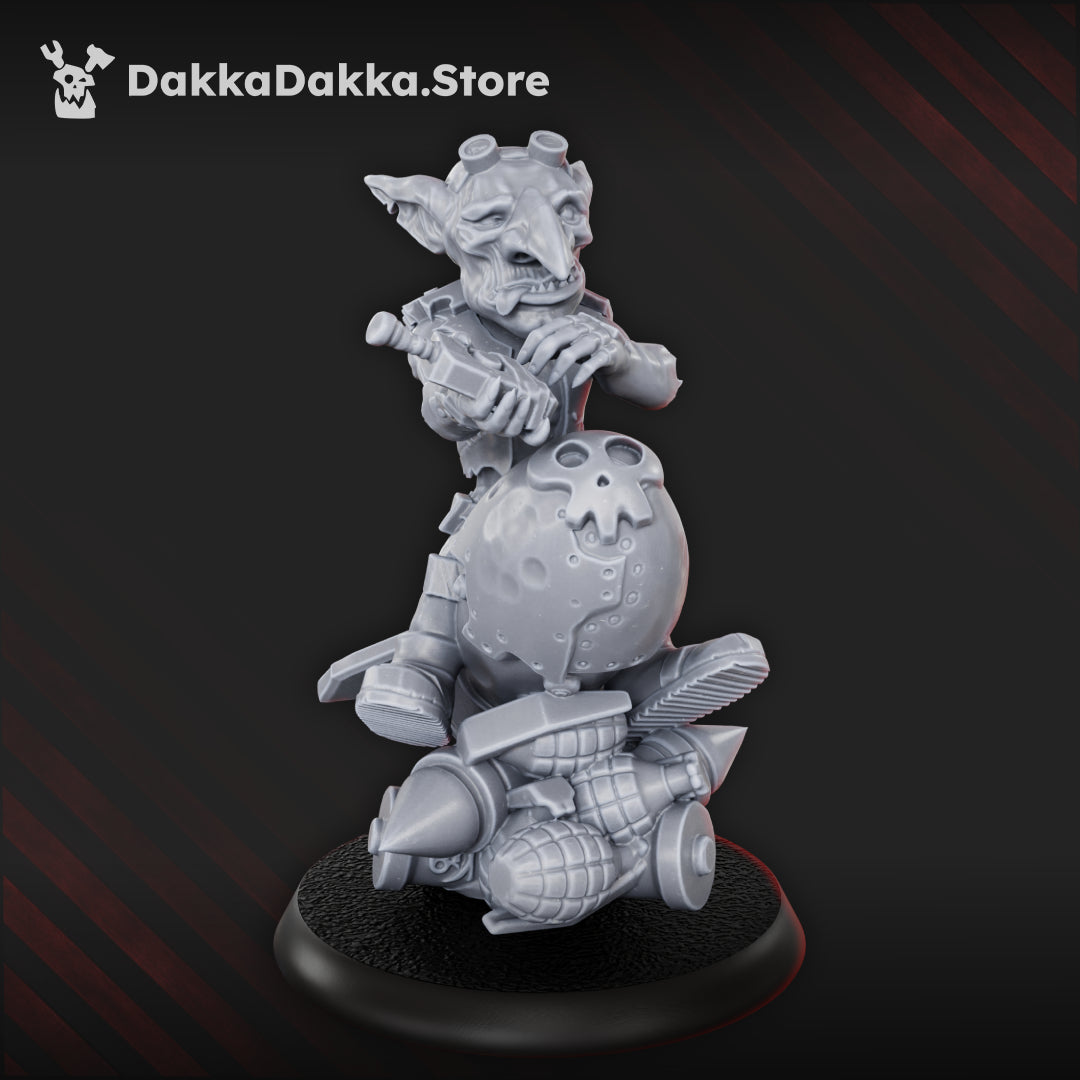 Bomb Goblin resin miniature by DakkaDakka, showing a goblin riding an oversized bomb with grenades, scrap details, and a skull-marked explosive casing.