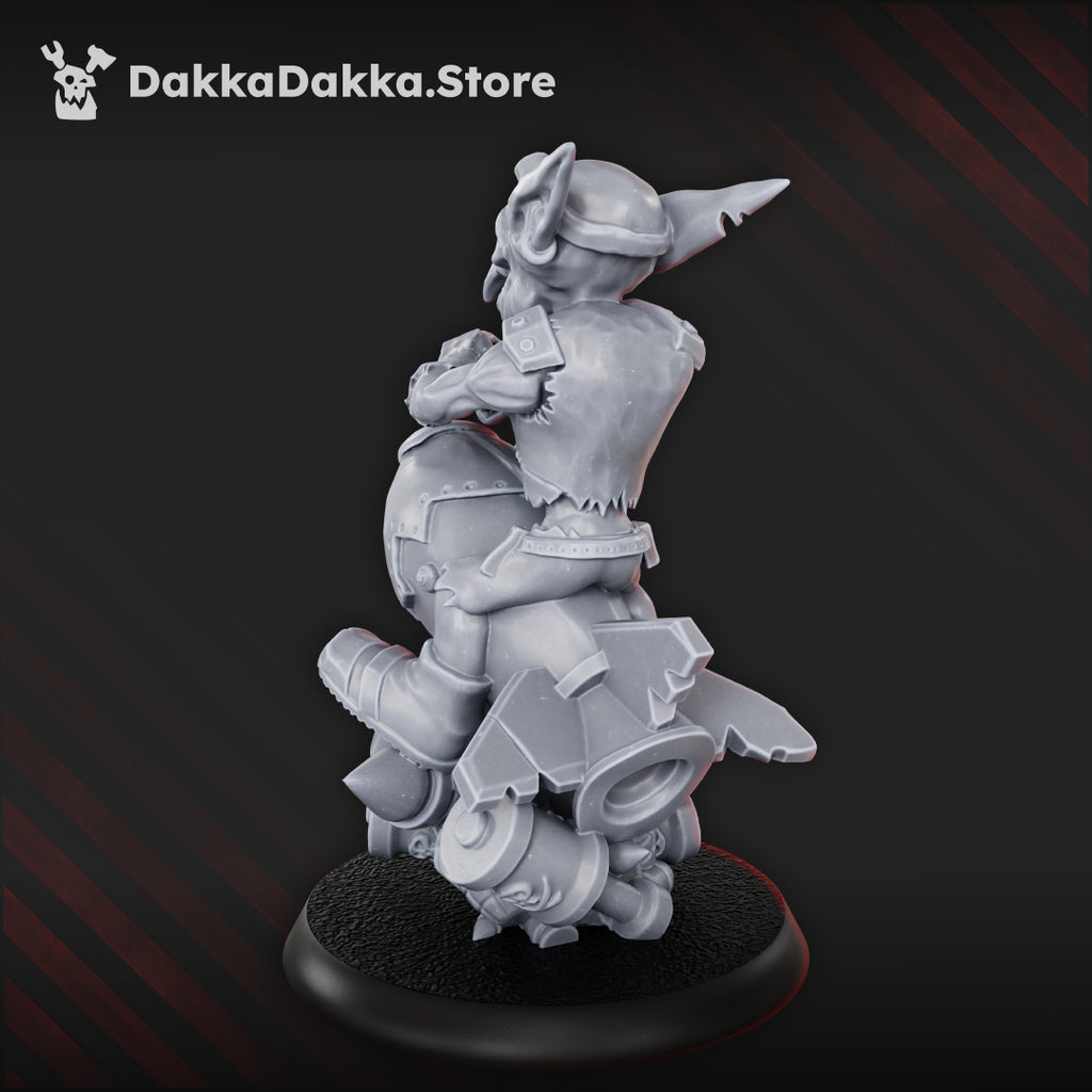 Rear view of Bomb Goblin miniature by DakkaDakka, showing the rocket-style bomb casing, goblin rider, and rear mechanical details.