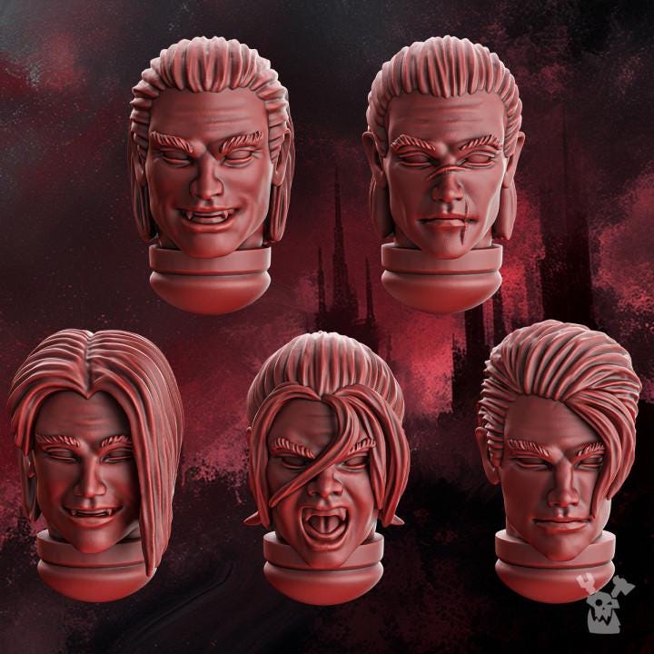 3D‑printed male character heads from the Crimson Wings set featuring detailed sci‑fi and fantasy‑style designs