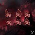 Resin 3D‑printed Crimson Wings Shoulder Pads by DakkaDakka, featuring multiple wing‑themed armor pad designs with sculpted feathers, vents, and smooth plates arranged around a central model preview.