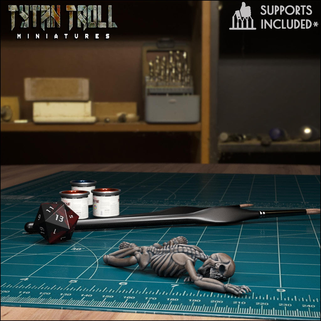 Resin 3D‑printed fallen skeleton miniature by TytanTroll.
