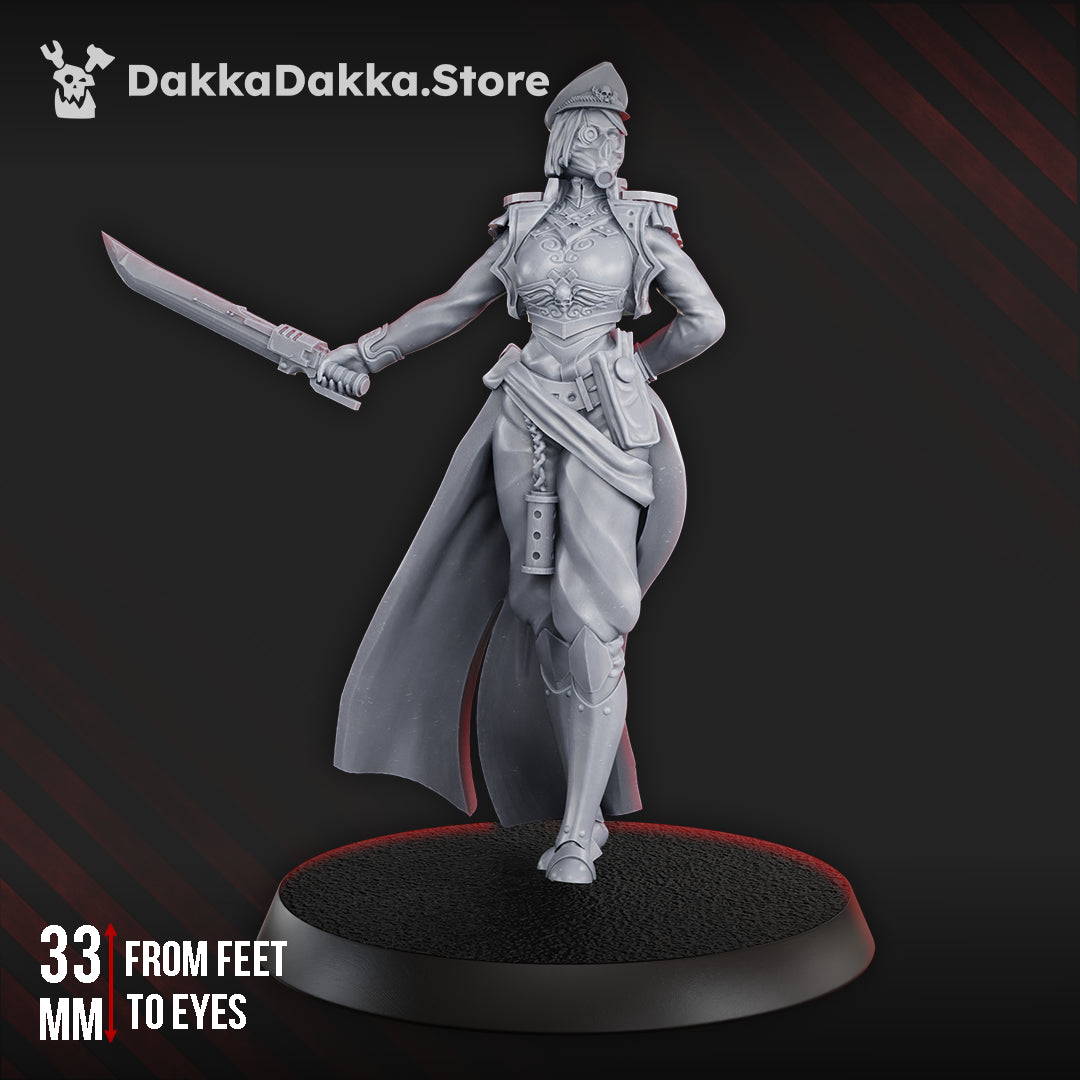 Female Commissar by DakkaDakka shown from the front with officer cap, ornate armor, long coat, and raised sword on a round base.
