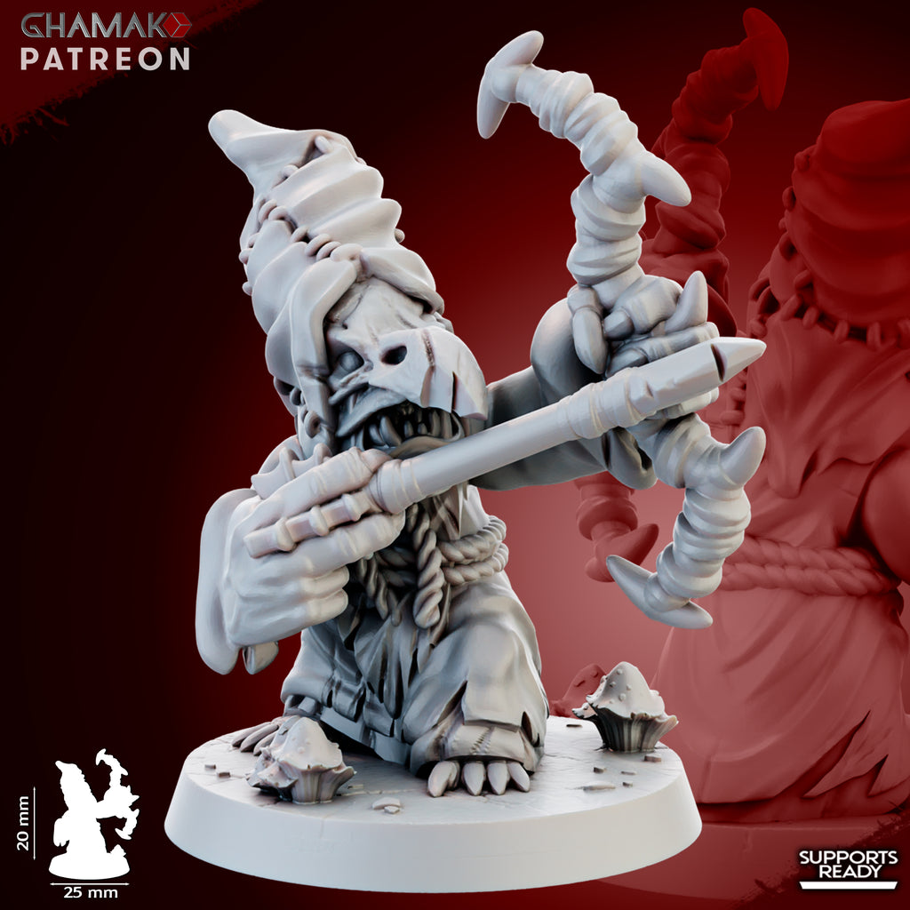 Close-up of a Madcaps Archer miniature by Ghamak, showing a goblin-style archer with stitched hood, bow, arrow, mushrooms, and detailed fantasy sculpting.