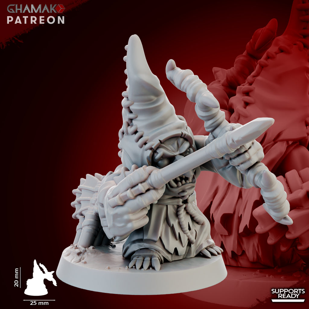 Close-up of a Madcaps Archer miniature by Ghamak, showing a goblin-style archer with stitched hood, bow, arrow, mushrooms, and detailed fantasy sculpting.