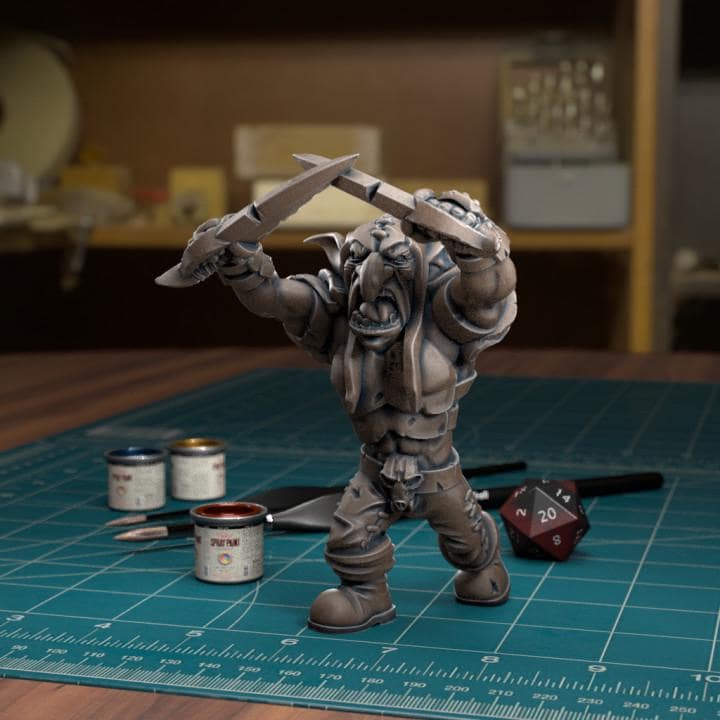 Resin 3D‑printed goblin raider miniature by TytanTroll holding two large blades overhead.