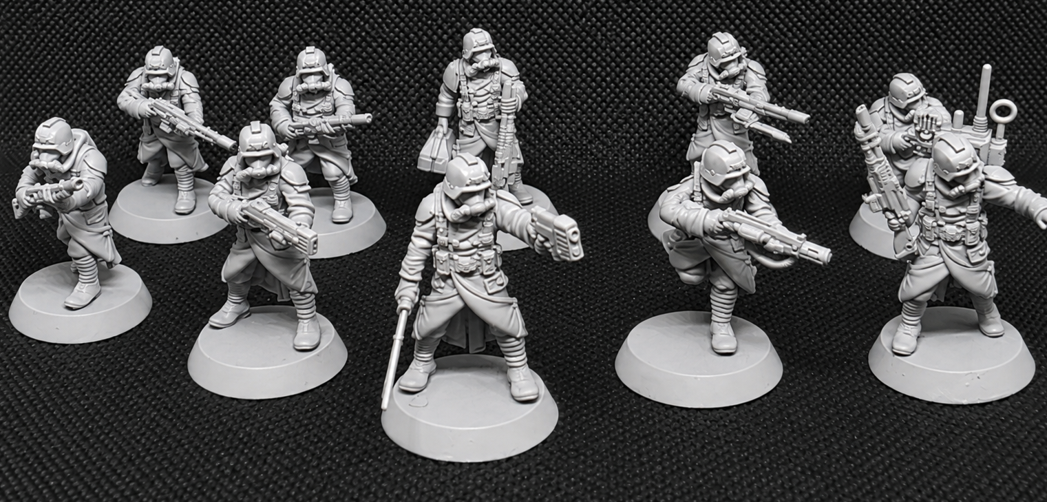 Ten pre-assembled GrimGuard Infantry resin miniatures by StationForge posed as a complete sci-fi trench warfare squad.