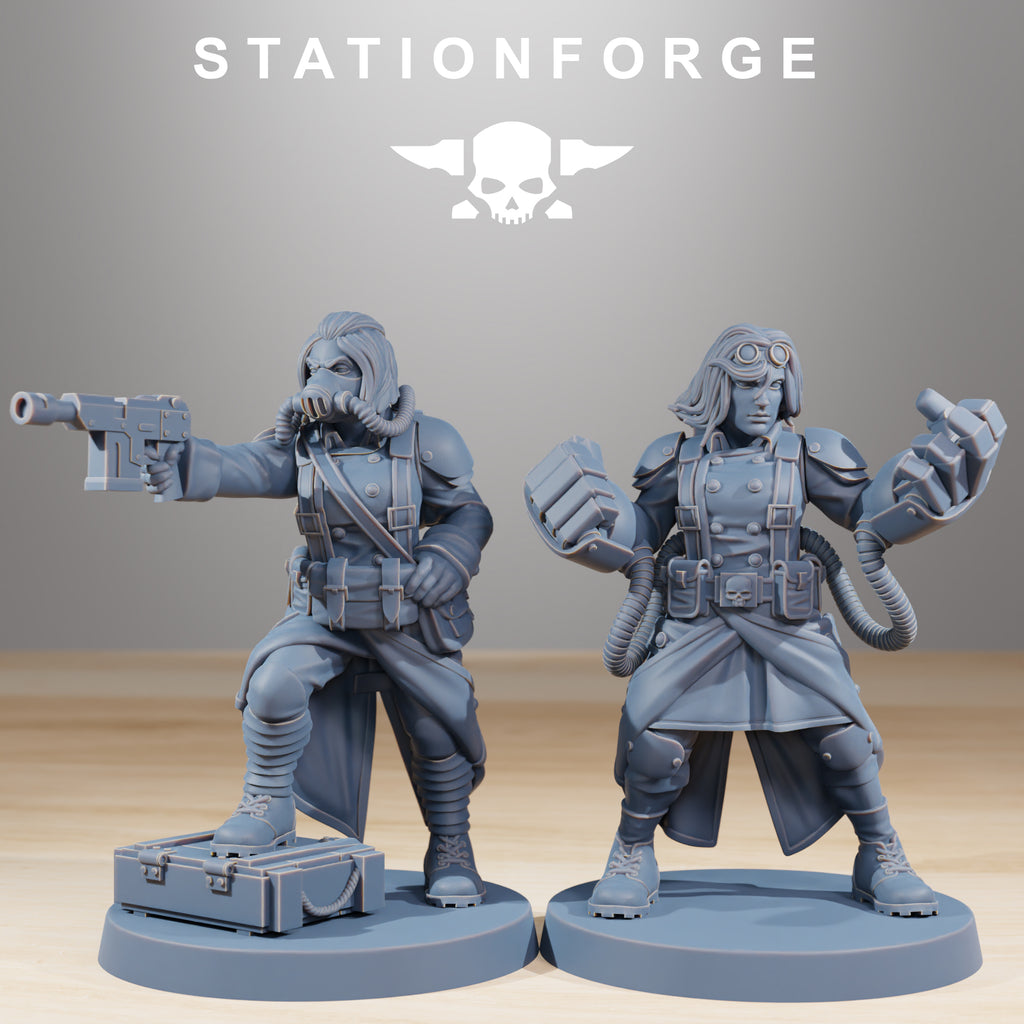 Two GrimGuard Sisters of War resin miniatures, including one aiming a pistol and one with large gauntlet-style weapons and goggles.