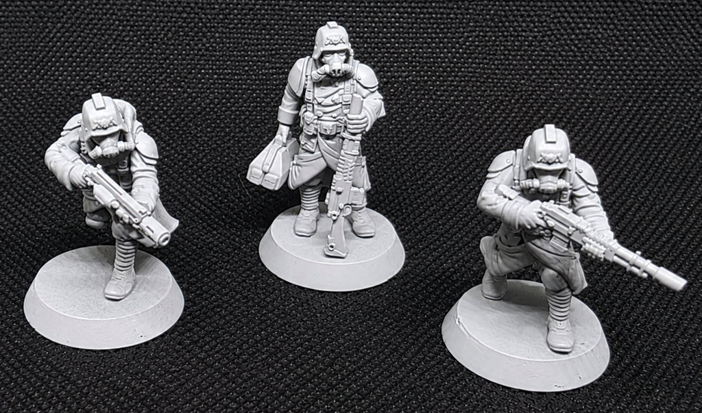 Three GrimGuard infantry specialists, including a field medic and two special-weapon soldiers.