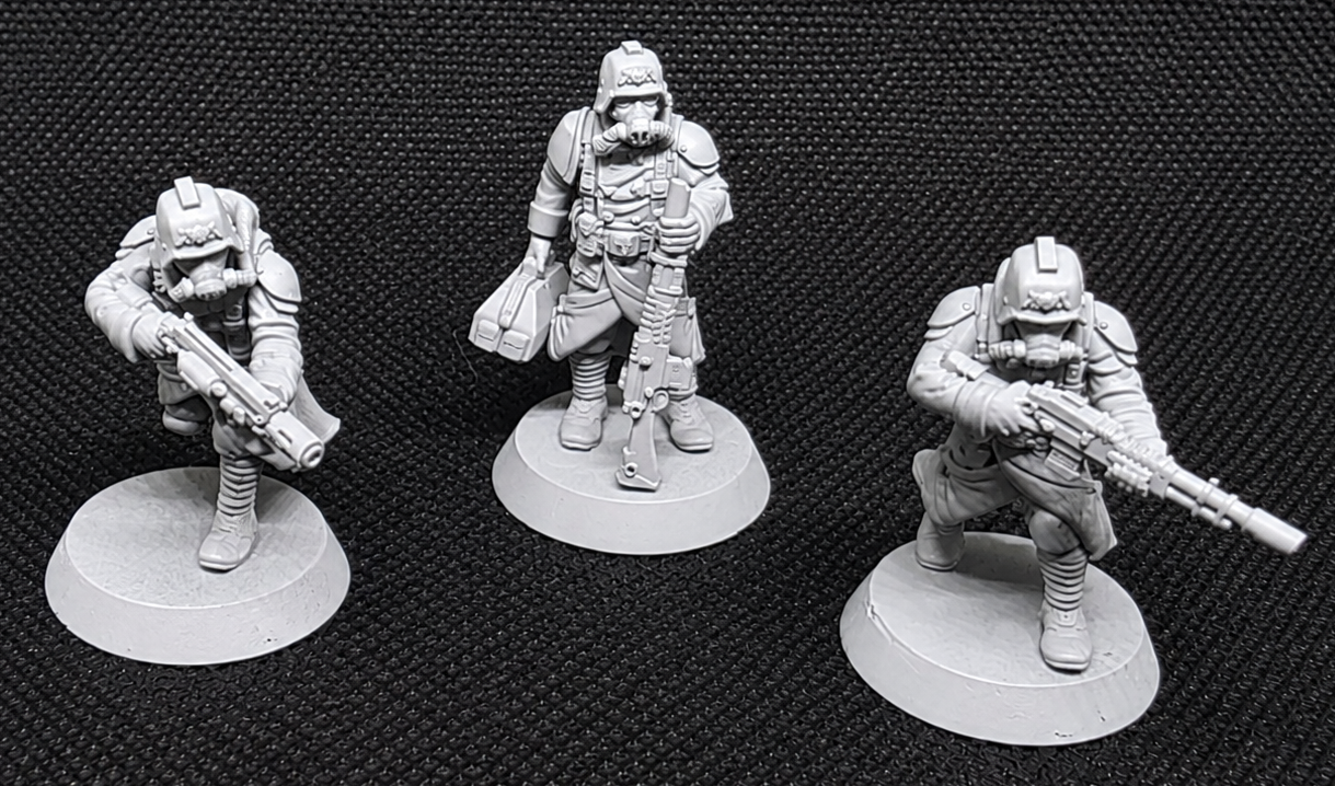 Three GrimGuard infantry specialists, including a field medic and two special-weapon soldiers.