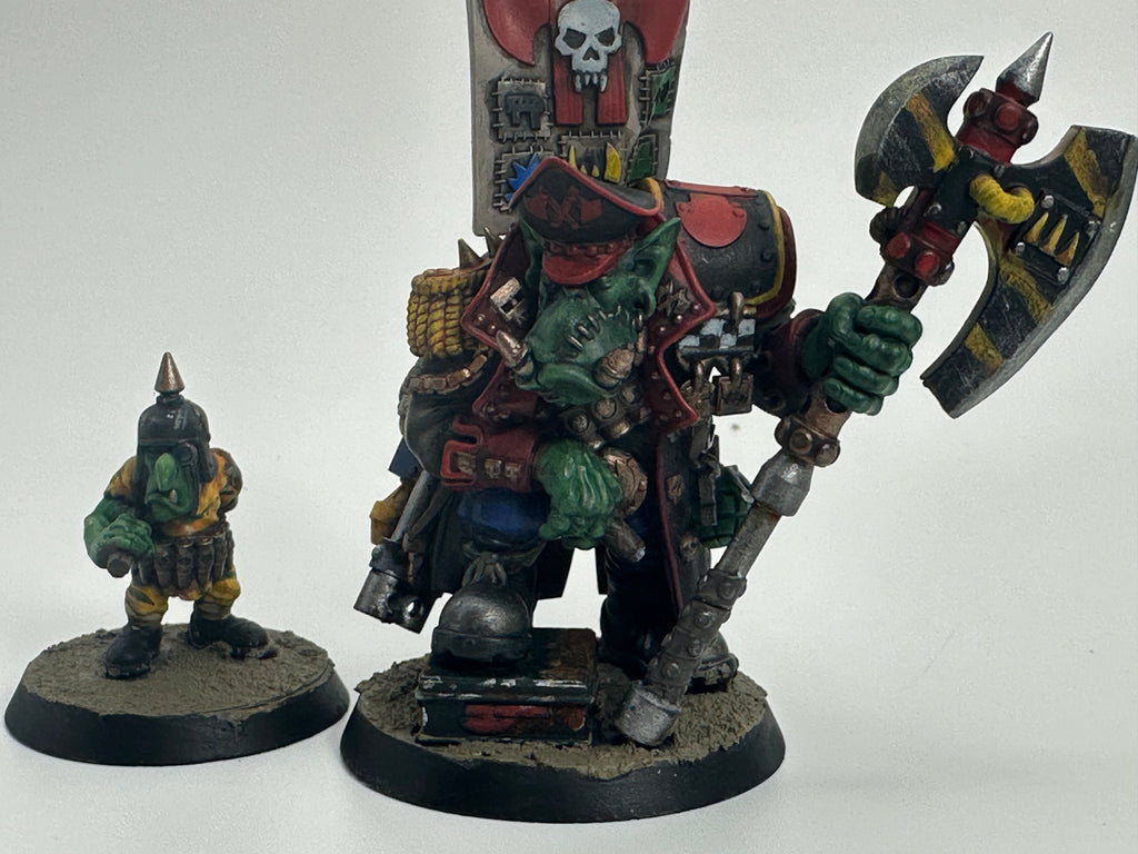 Painted Guttertech Orc Banner Boss and his Goblin companion on decorated bases