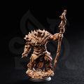 Front view of Hvitabjörn bearfolk druid miniature showing layered fur, foliage, and vine-covered staff