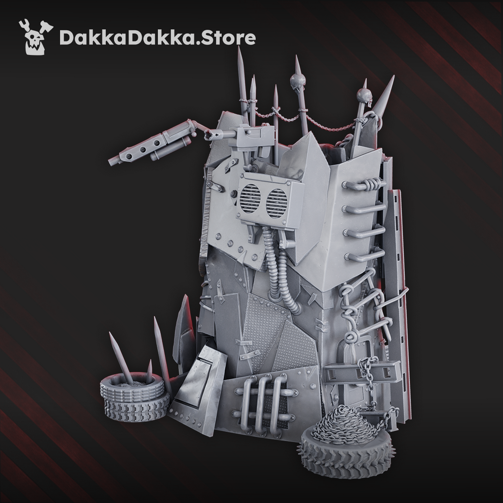 Mekaz Hogyard fortified terrain tower by DakkaDakka featuring welded scrap panels, spikes, chains, cables, vents, tires, and improvised weapons.
