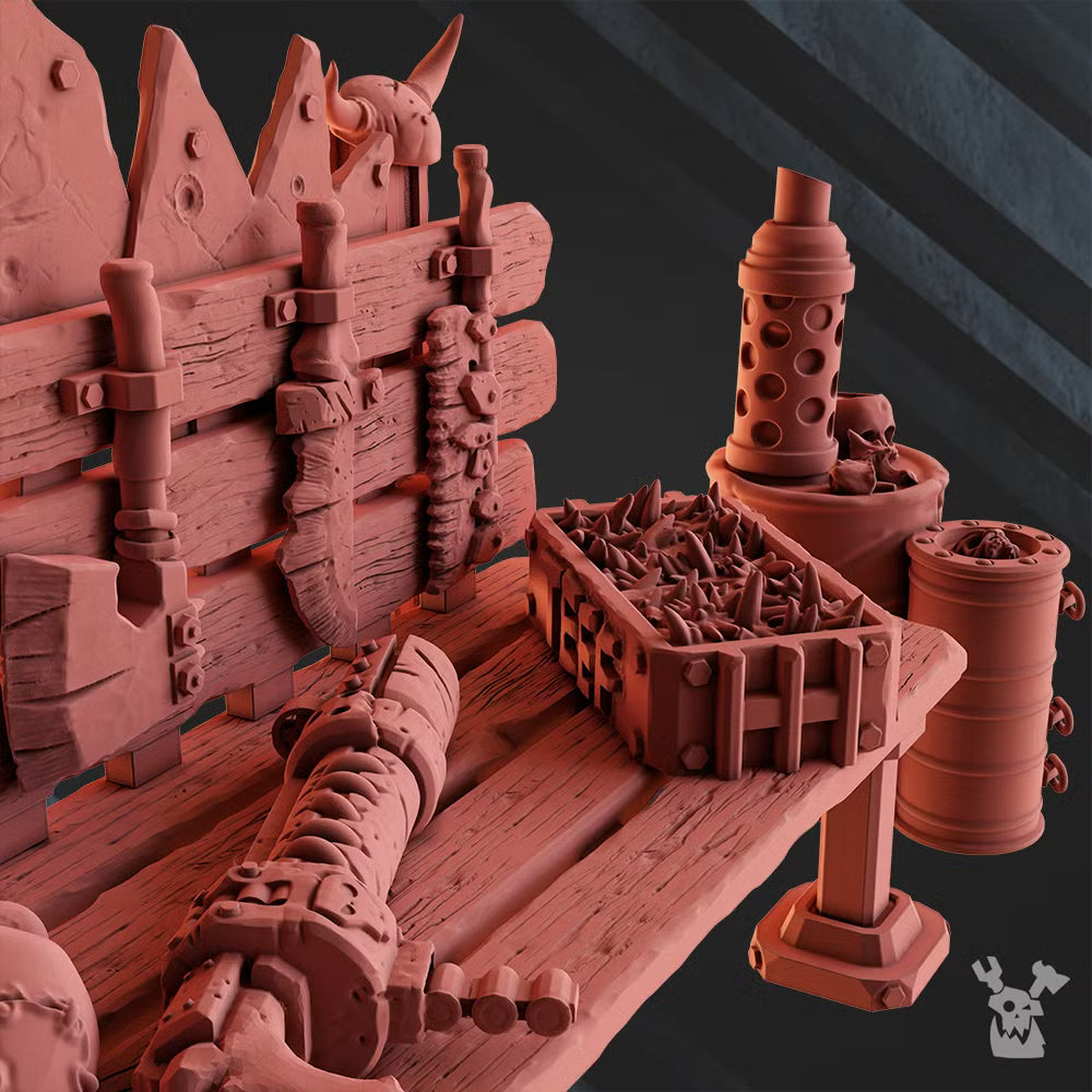 Close-up of the Orcs Terrain workbench and ammo cache, showing loose rounds, weapons, barrels, and spiked scrap barricade details.