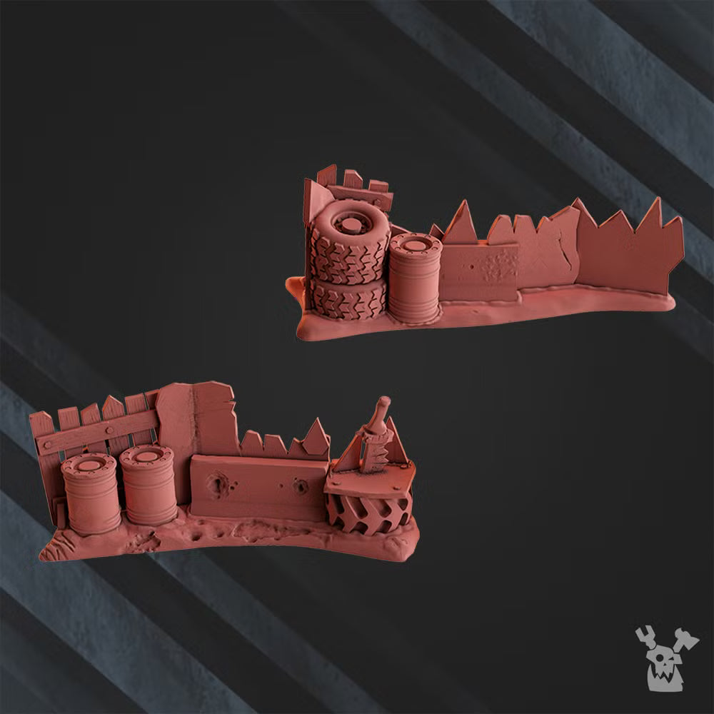 Two ramshackle sci-fi orc barricade terrain sections with scrap walls, tires, barrels, and industrial battlefield details.