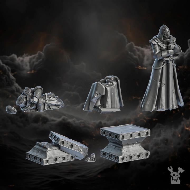 Resin 3D‑printed Order of Repentance Terrain by DakkaDakka featuring a standing robed armored figure, a collapsed armored body, a broken torso section, and multiple shattered architectural blocks with mechanical detailing