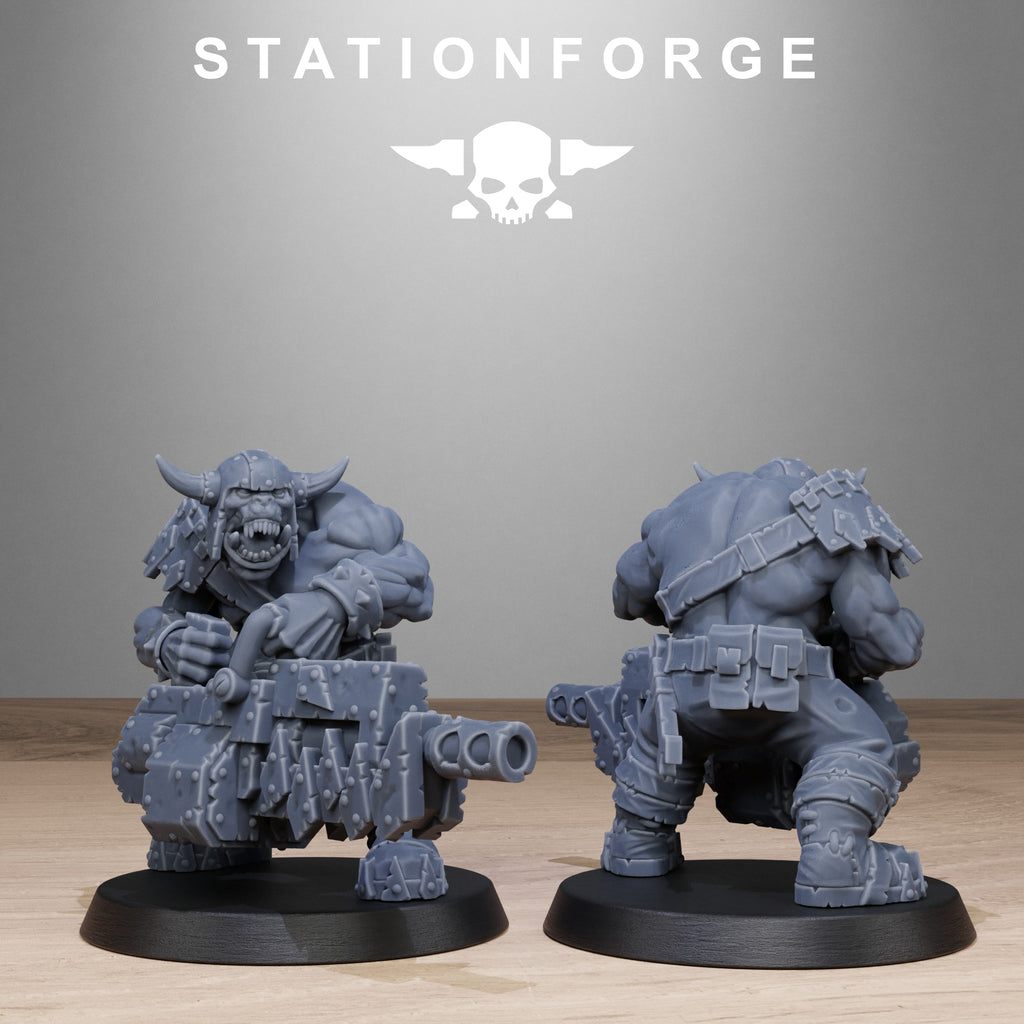 Sci-fi orc infantry miniature holding a large double-barreled gun, shown from front and rear with armored back plates and skull detail.