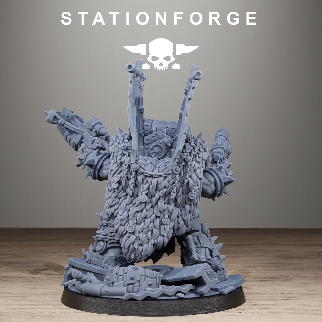 Rear view of the Orkaz Brutal Boss showing its thick fur cloak, chains, mechanical backpack, and twin banner poles