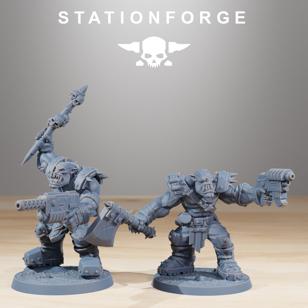 Two Orkaz Infantry miniatures by Station Forge, featuring sci-fi alien soldiers armed with pistol, axe, and rifle in aggressive combat poses.
