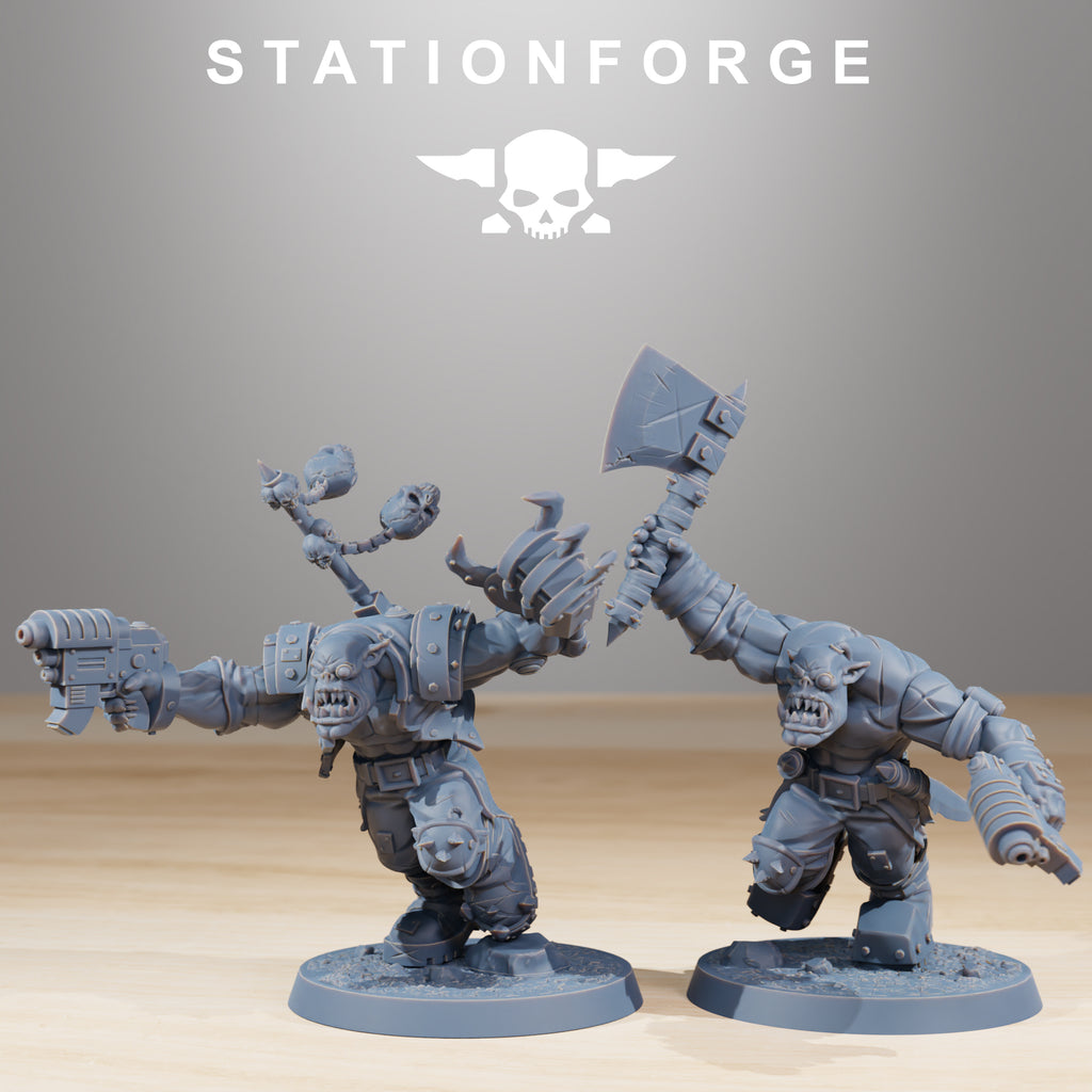 Two Orkaz Infantry miniatures by Station Forge, shown charging forward with axe, pistol, and melee weapon details.