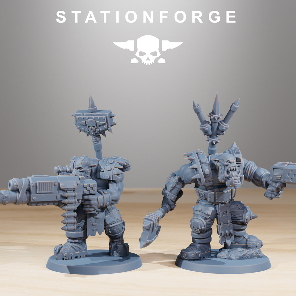 Two Orkaz SkullKrushers resin miniatures by Station Forge, showing a ranged Orkaz trooper and a melee-oriented Orkaz with axe and sidearm.
