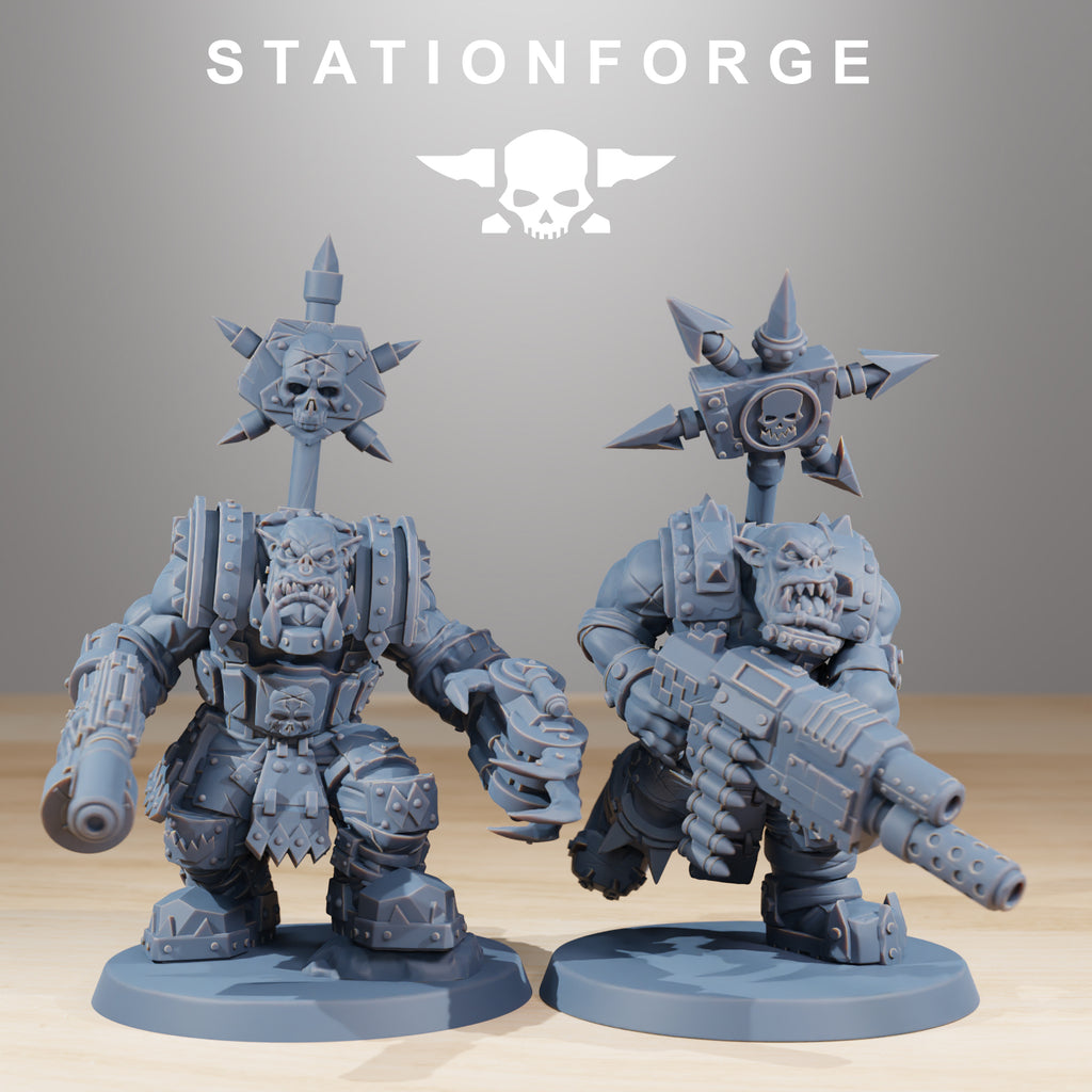 Two Orkaz SkullKrushers resin miniatures by Station Forge, showing armored Orkaz with clawed gauntlet, pistol, and aggressive sci-fi infantry poses