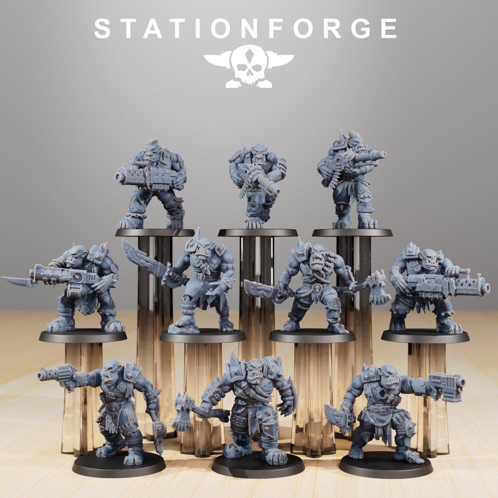 Full Orkaz Strappaz squad by Station Forge showing 10 modular sci-fi greenskin miniatures with heavy weapons, axes, armor, and varied poses.