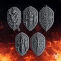 Pactum Aeternum Crusader shield bits by DakkaDakka, showing five gothic sci-fi resin shields with relics, chains, skulls, blades, and cross iconography.