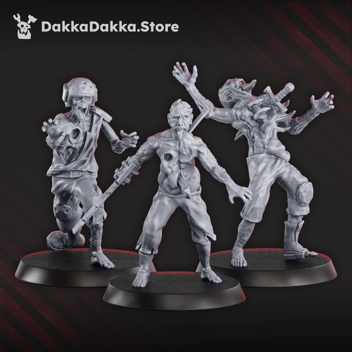 Three unpainted Pandemic Zombies miniatures showing varied infected survivor poses and scavenged clothing.
