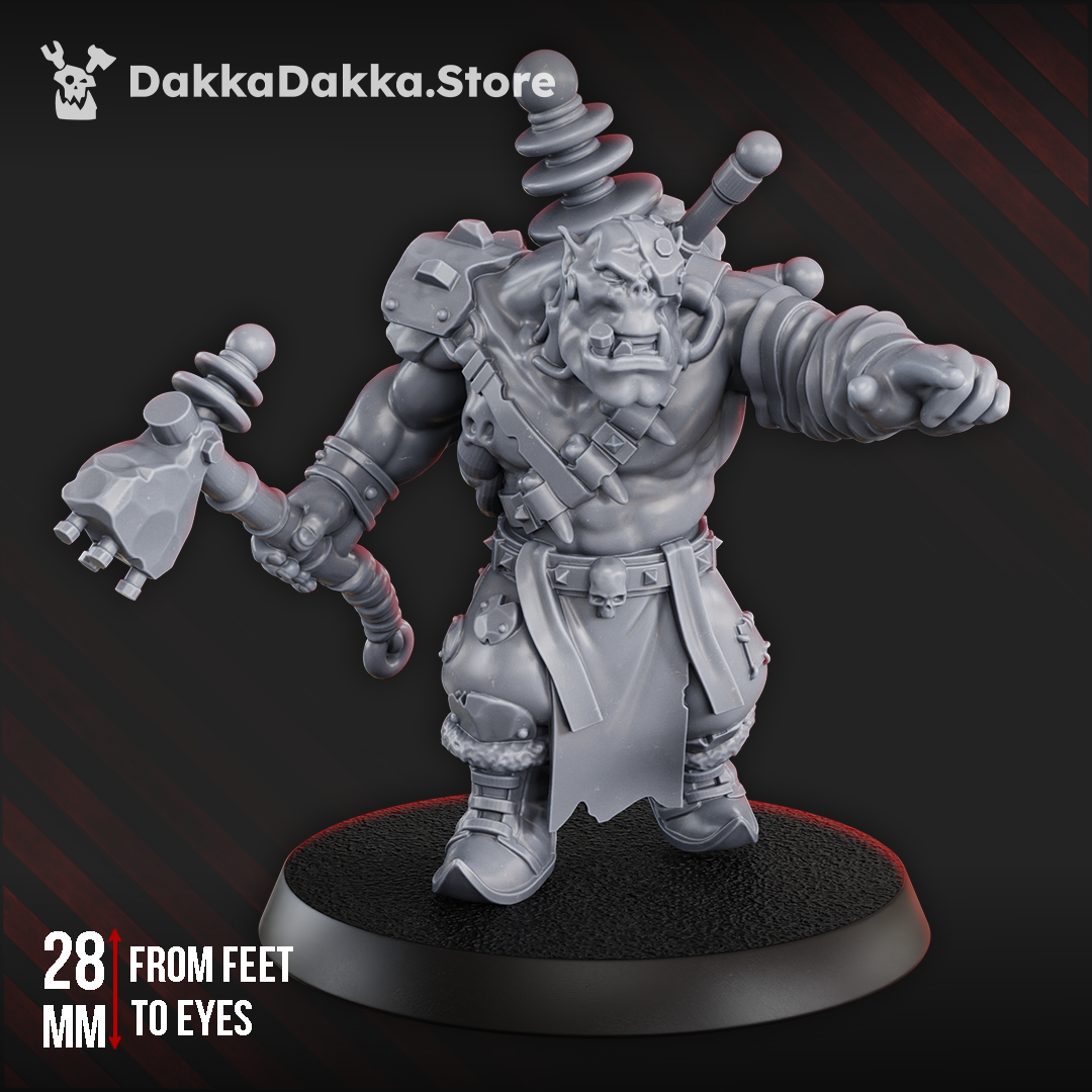 Front view of the Tech Boy sci-fi orc mechanic by DakkaDakka holding a coil-powered industrial hammer and pointing with an insulated gauntlet.
