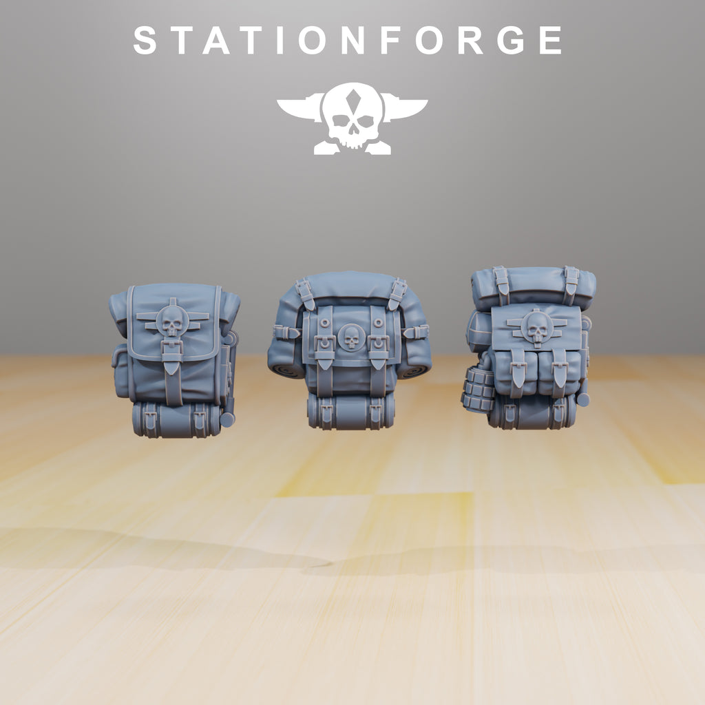 Three Grimguard Infantry Builder backpacks in gray resin with bedrolls, pouches, and skull details.