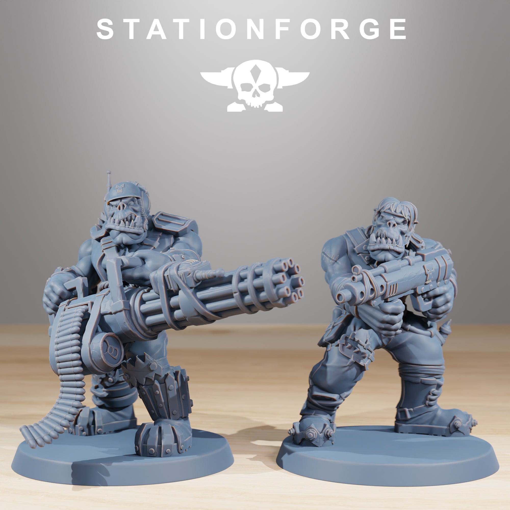 Two Orkaz Skillers miniatures by Station Forge with oversized ranged weapons, including a rotary-style heavy gun and compact blaster.