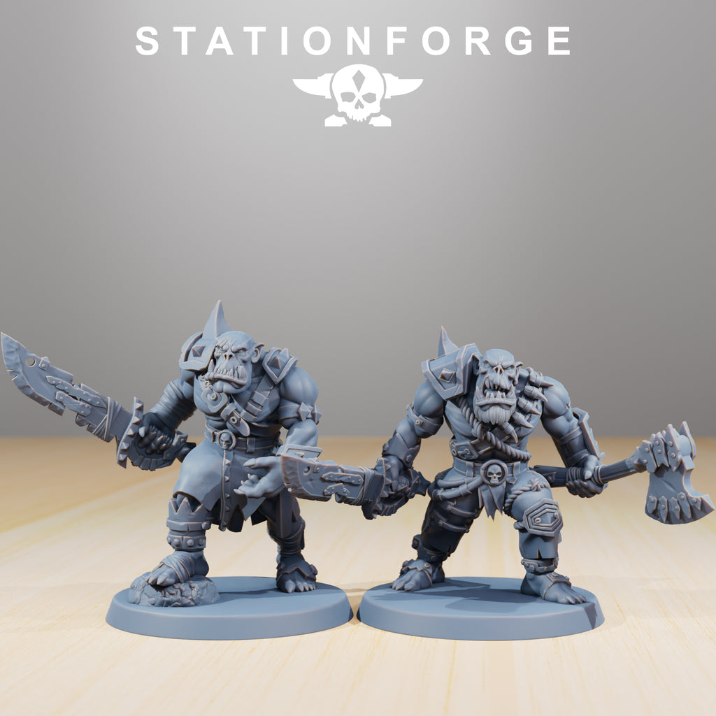 Two Orkaz Strappaz miniatures by Station Forge armed with brutal melee weapons and heavy armor, shown as part of a modular sci-fi squad.